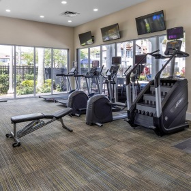 Open and well-lit fitness center Open and well-lit fitness center at The Isles